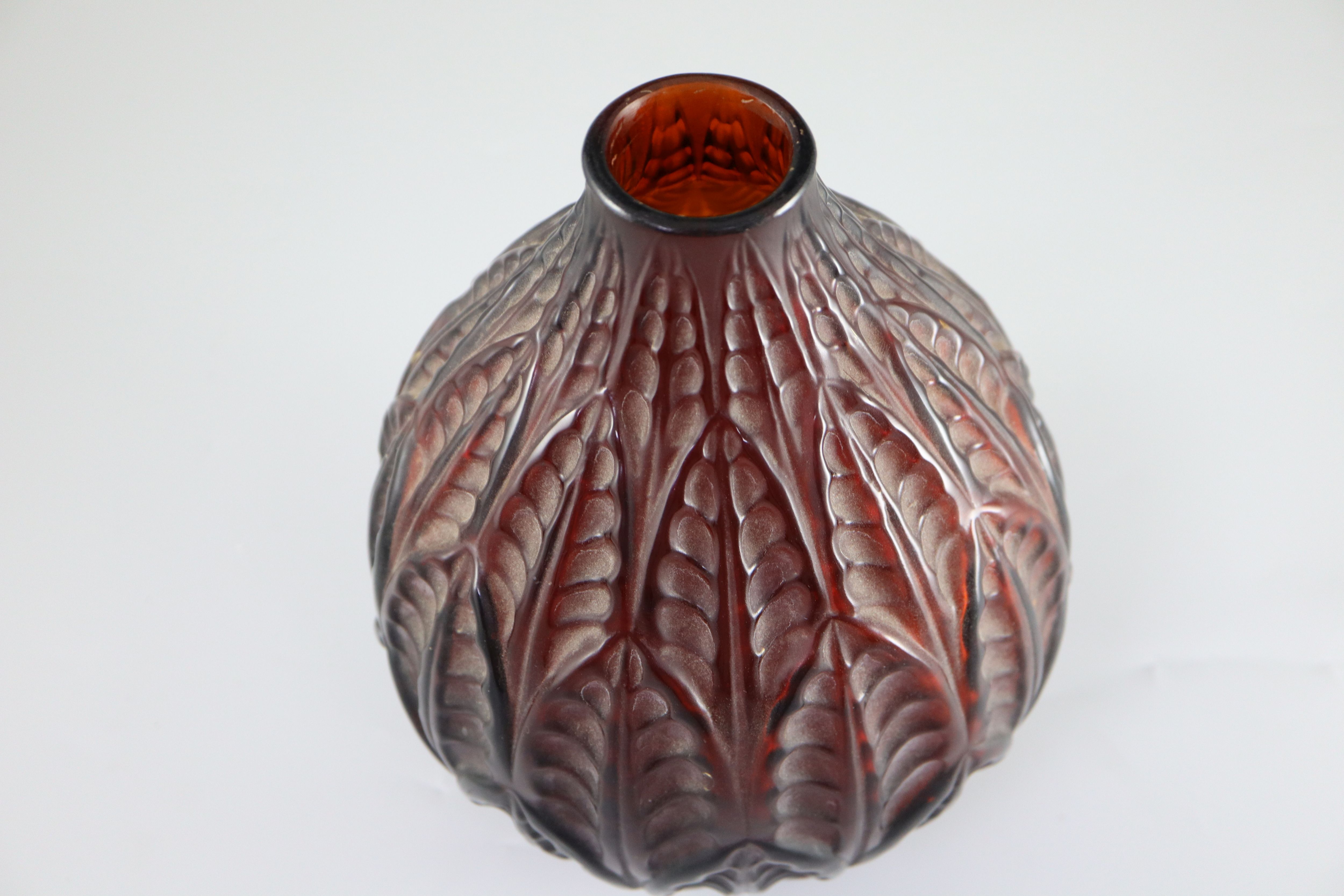 PLEASE NOTE THE NECK HAS BEEN REDUCED René Lalique. A pre-war dark amber glass Malesherbes vase, no.1014, designed in 1927, 22cm high